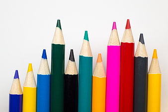 Colorful Pencils Arranged as Bar Chart on White Background