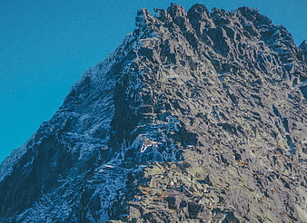 Rock Climbers Scaling Rugged Mountain Peak