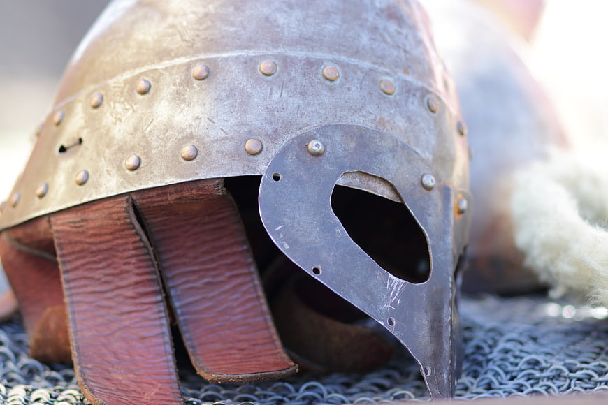 Close-up of medieval metal helmet with leather neck guard