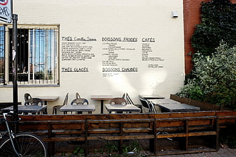 Outdoor Cafe Terrace with Menu on Wall
