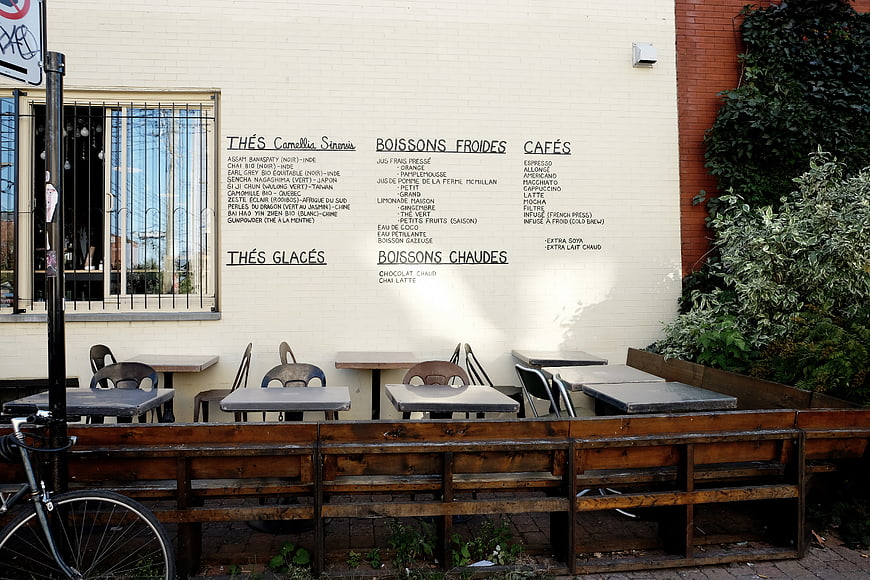 Outdoor Cafe Terrace with Menu on Wall