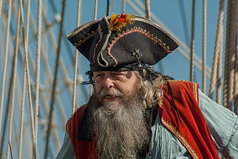 Bearded Pirate Costume Portrait On Sailboat Rigging