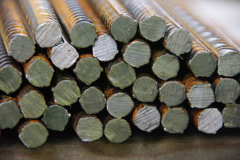 Close-up of stacked rusty steel reinforcing bars for construction