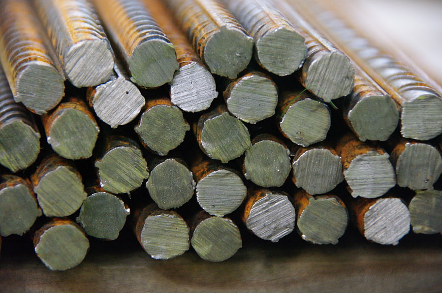 Close-up of stacked rusty steel reinforcing bars for construction