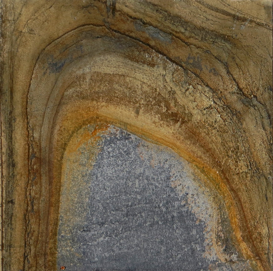 Abstract rock texture with natural arch and earthy tones