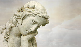 Close-up of classical marble statue head with contemplative expression