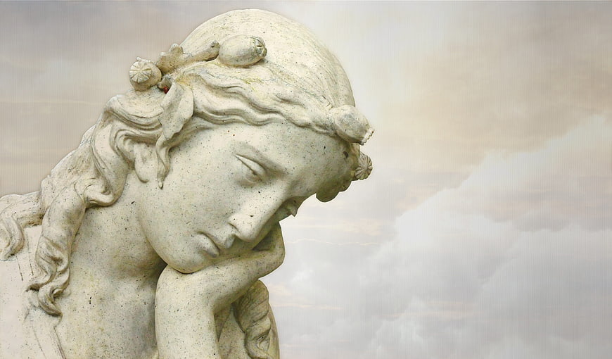 Close-up of classical marble statue head with contemplative expression