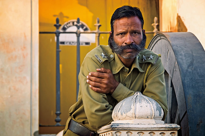 Portrait of Indian Security Guard in Olive Uniform