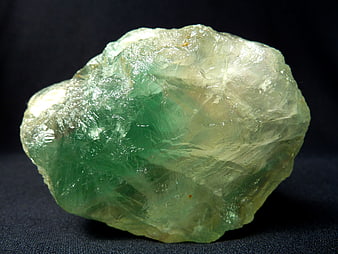 Raw Green Fluorite Crystal Specimen on Dark Background