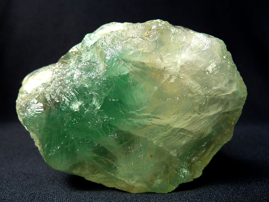 Raw Green Fluorite Crystal Specimen on Dark Background