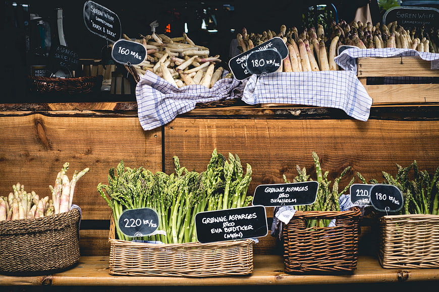 Fresh green and white asparagus at a farmers market
