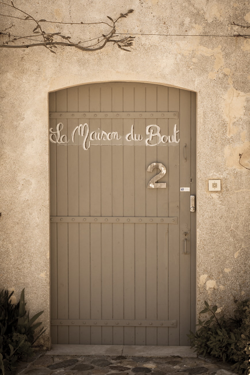 Rustic French Door with La Maison du Bout Sign