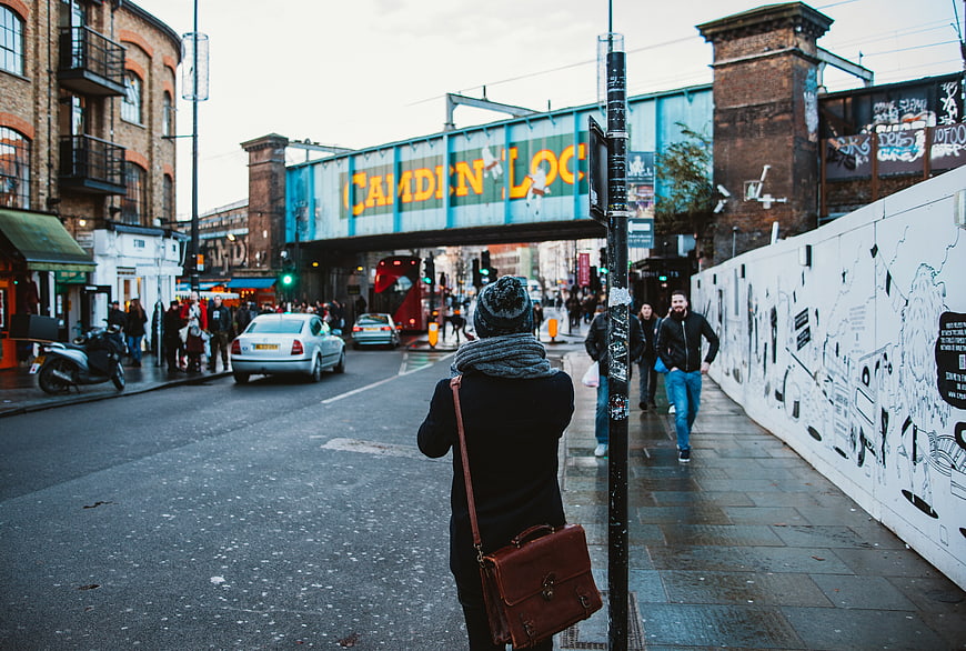Woman walking on Camden Lock street in London