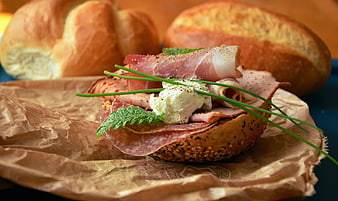 Open-Faced Bagel Sandwich With Cured Meat, Cream Cheese, And Fresh Herbs