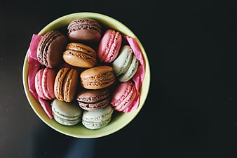 Top View of Colorful Macarons in a Green Bowl