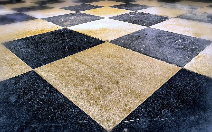 Vintage Black and Beige Checkerboard Stone Floor Texture
