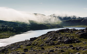 Misty Mountain Lake Landscape with Rocky Foreground