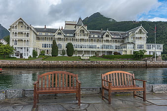 Historic Hotel by Fjord with Wooden Benches