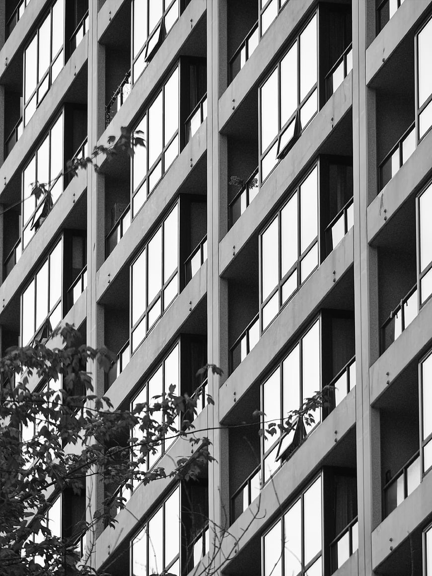 Black and white modern building facade with geometric window pattern