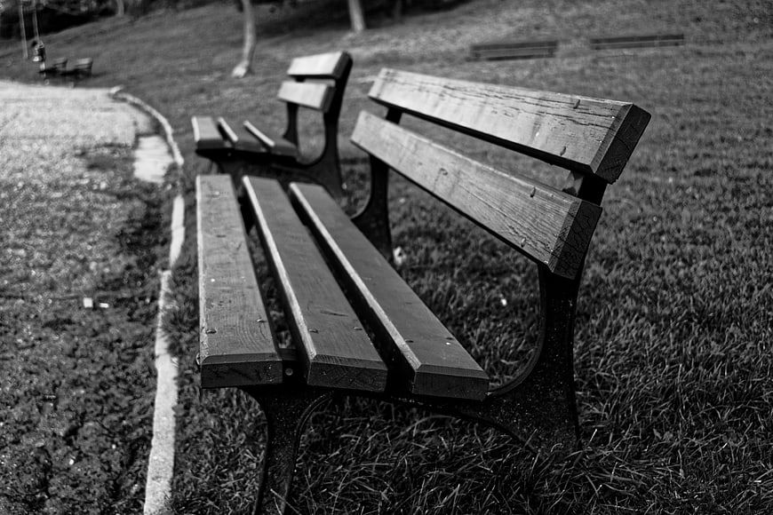 Empty Wooden Park Bench in Black and White