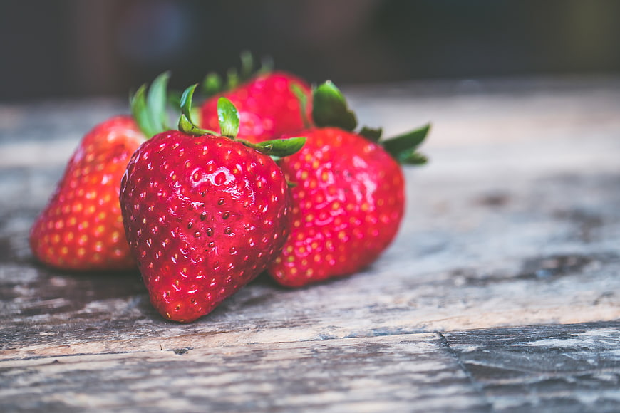 Fresh Red Strawberries on Rustic Wooden Surface