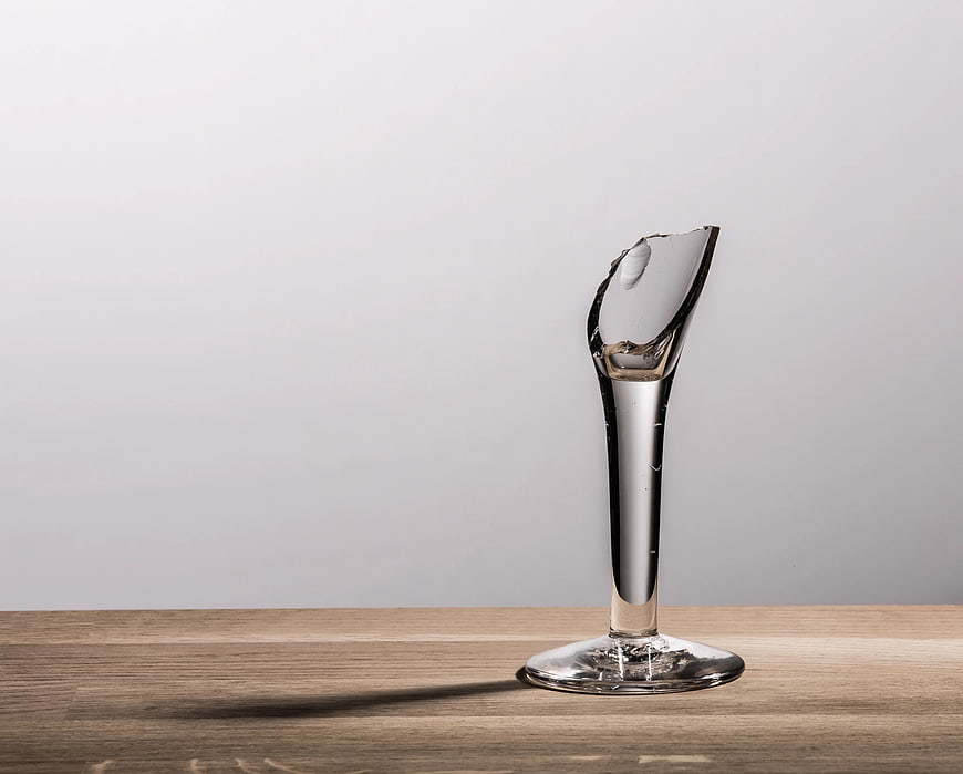 Broken Glass Vase on Wooden Table
