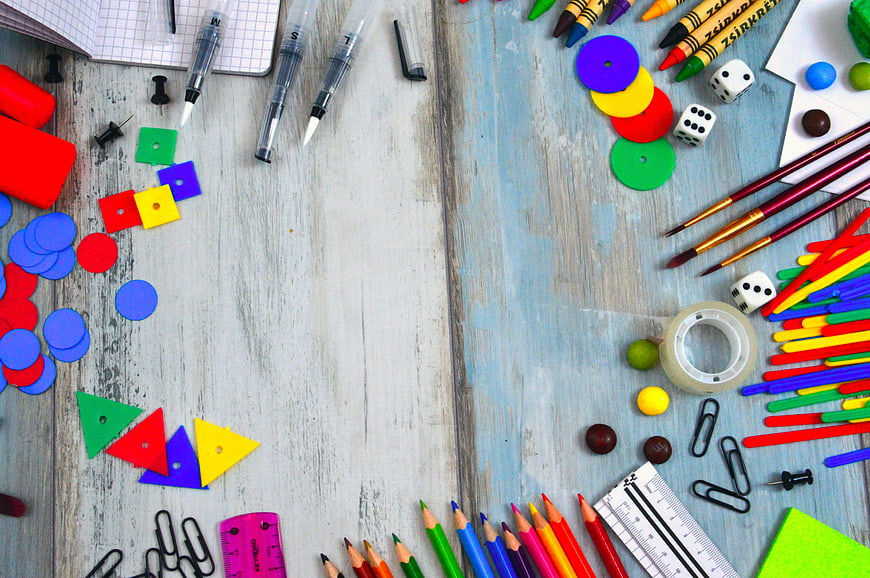 Colorful School Supplies Flat Lay on Blue Wooden Desk