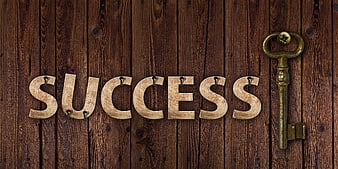 Wooden Success Letters And Vintage Key On Dark Wood Background