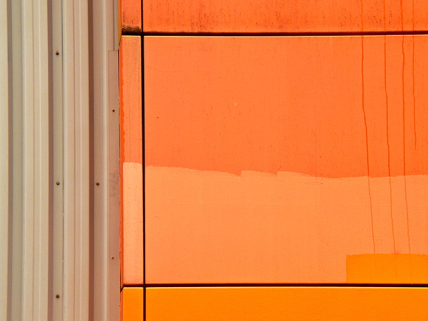 Abstract Orange Metal Wall Texture Close-Up