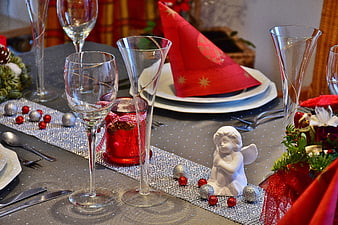 Festive Christmas Table Setting With Red Napkins And Glassware