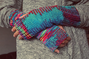 Colorful Knitted Fingerless Gloves on Gray Sweater