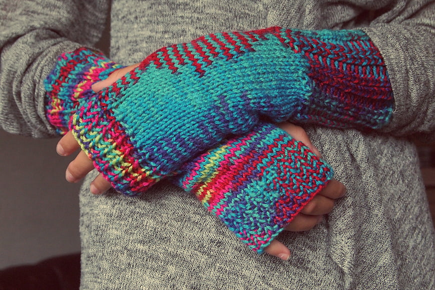 Colorful Knitted Fingerless Gloves on Gray Sweater