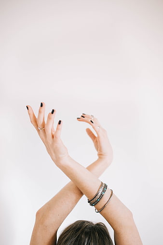 Woman's Hands with Black Nails and Silver Bracelets