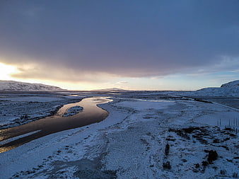 Aerial View of Snowy River Valley in Iceland at Sunset