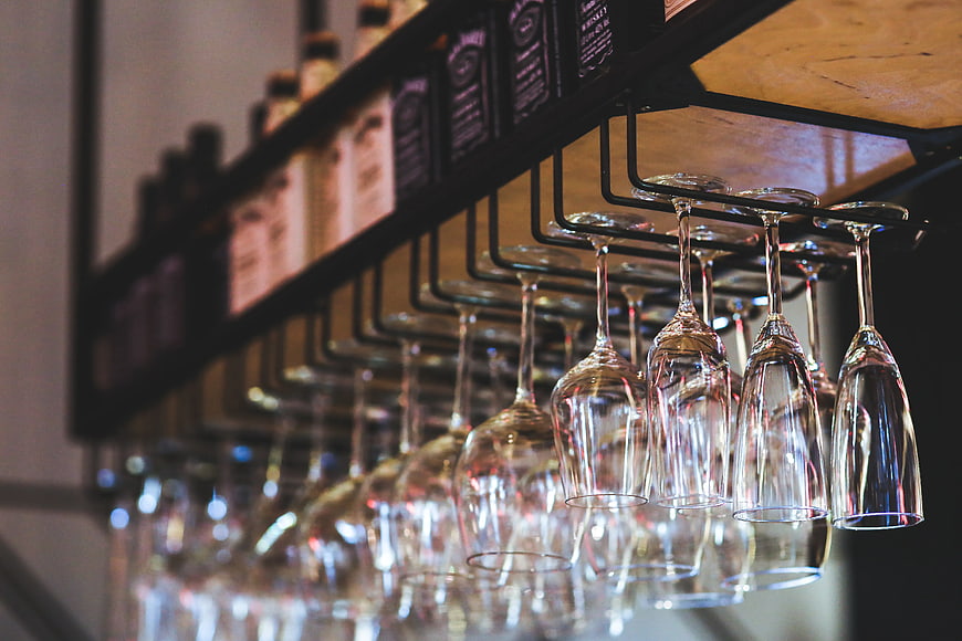 Hanging wine glasses in a modern bar interior