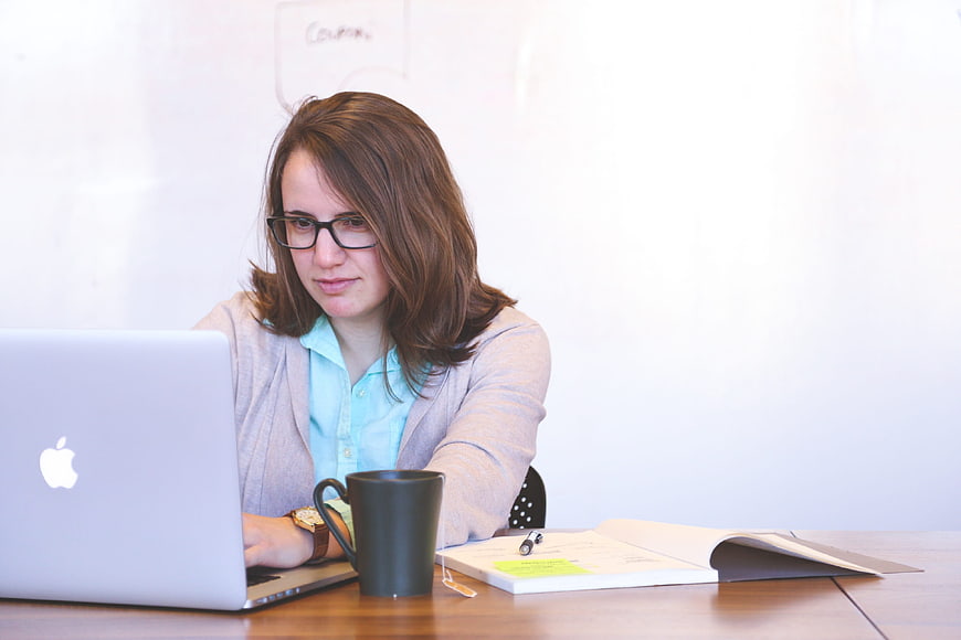 Young woman working on laptop in office