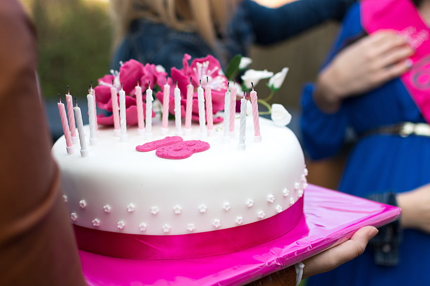 Sweet 16 Birthday Cake with Pink Candles and Flowers