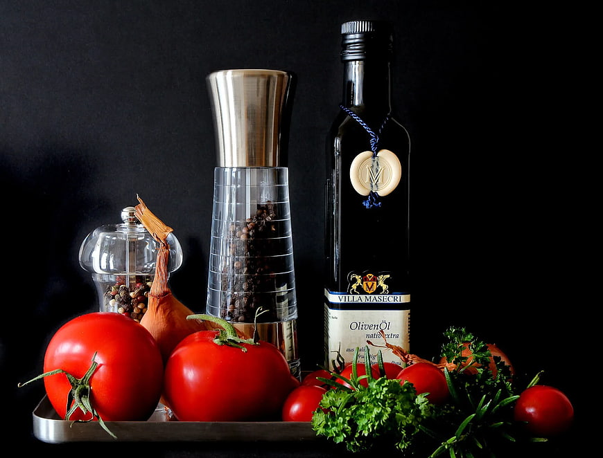 Fresh Tomatoes, Herbs, and Olive Oil on Black Background