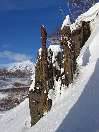 Snow-Covered Rock Formations in Kamchatka Winter Landscape