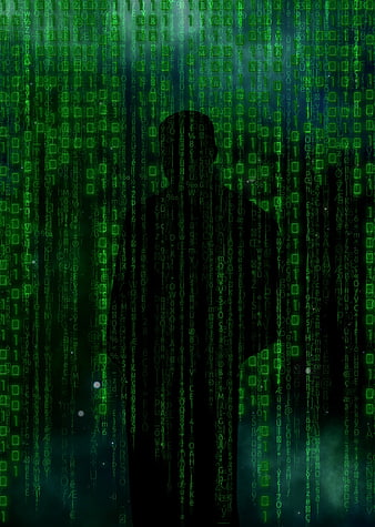 Silhouette of Hacker Against Green Digital Code Rain