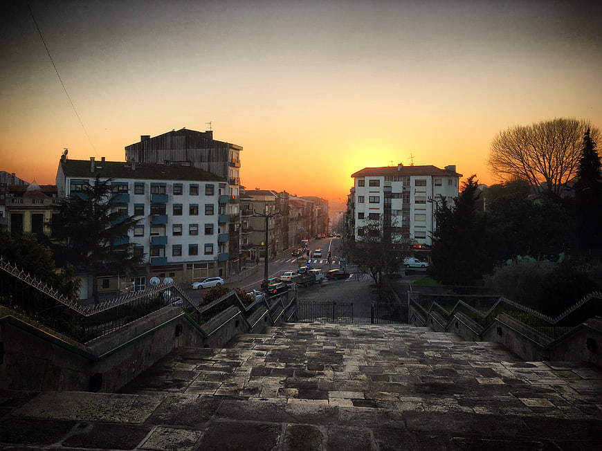 Sunset View Down Urban Street From Stone Stairs