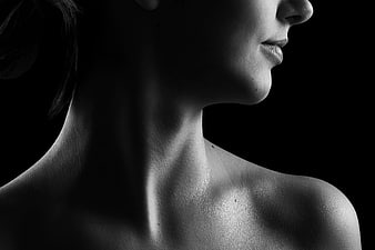Black and white profile portrait of a woman's neck and shoulders