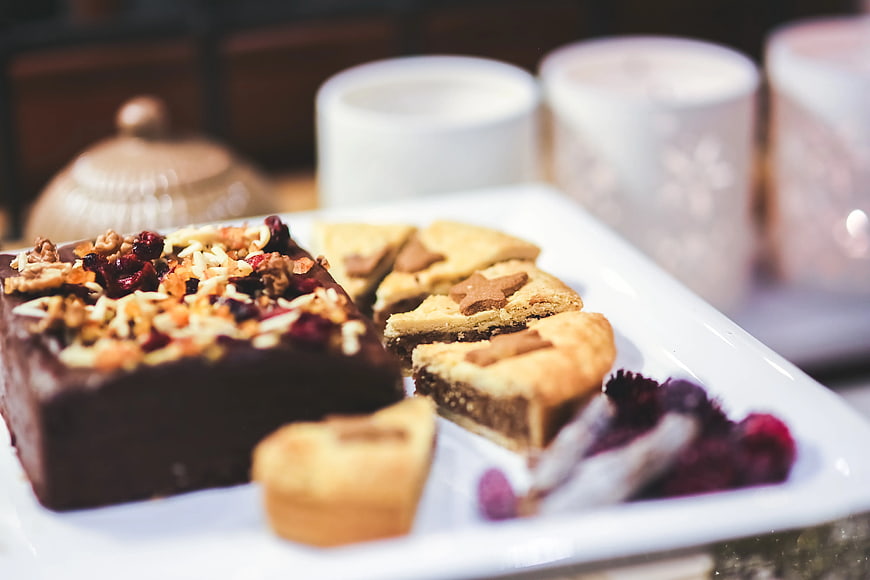 Assorted Christmas Cookies and Chocolate Cake on White Plate