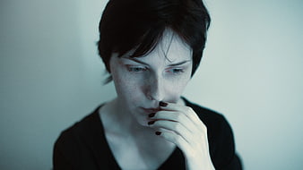 Moody Portrait of Pensive Woman with Short Hair