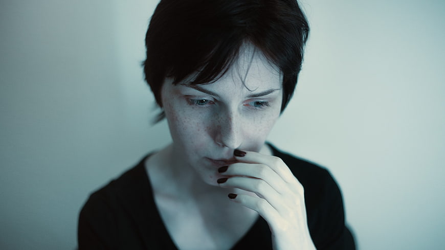 Moody Portrait of Pensive Woman with Short Hair