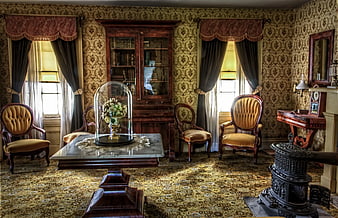 Vintage Victorian parlor with ornate furniture and floral wallpaper