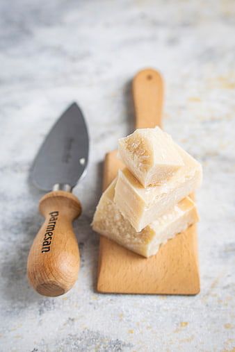 Stacked Parmesan Cheese Cubes on Wooden Board