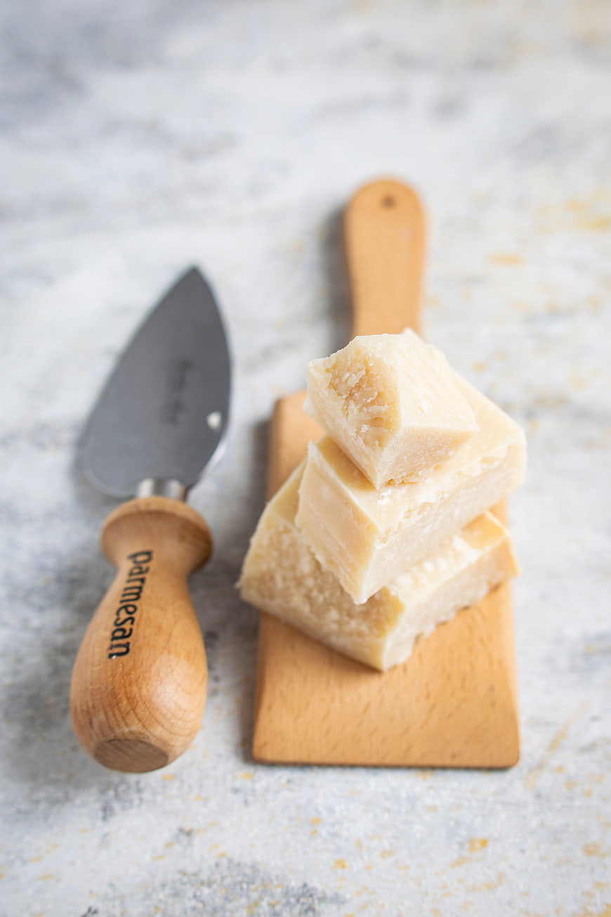 Stacked Parmesan Cheese Cubes on Wooden Board