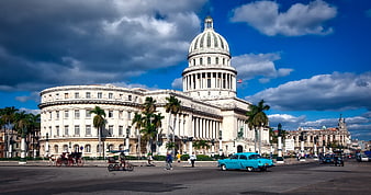 Havana Capitol Building with Vintage Blue Car and Palm Trees