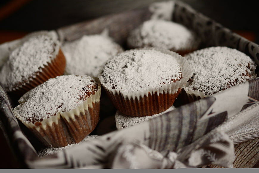 Chocolate Muffins with Powdered Sugar in a Basket